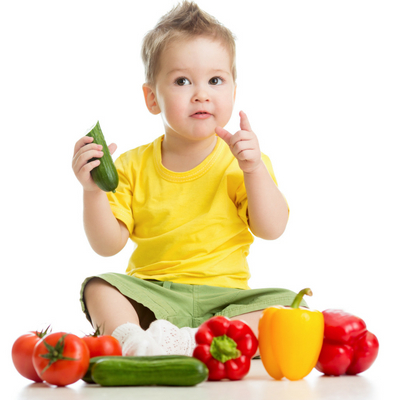 Creative Ways to Cook Veggies that Your Kids Will Actually Eat. Toddler eating colorful vegetables.