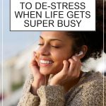 Easy Ways to De-stress When Life Gets Busy. Young woman outside listening to music on headphones.