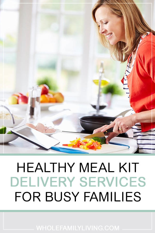 Healthy Meal Kit Delivery Services for Busy Families. Mom following recipe and preparing a family meal.