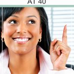 Things to Consider Before You Make a Career Change at 40. Woman sitting in her office having an ah-ha moment.