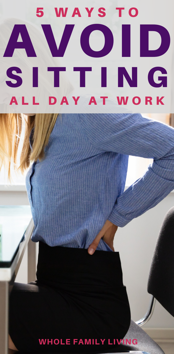 Woman having back pain sitting at work desk. Health Risks of Sitting All Day at Work - Whole Family Living