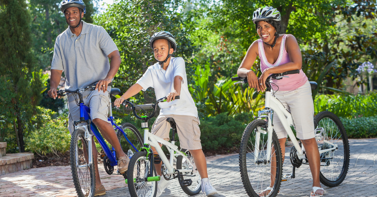 Family riding bicycles outside. Creating a Fitness Plan for the Whole Family -Whole Family Living