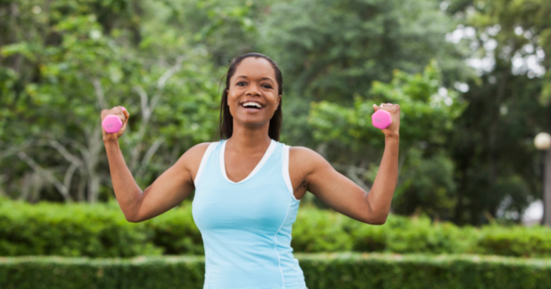 African American woman exercising in the park with hand weights. How to Start a Healthy Lifestyle - Whole Family Living